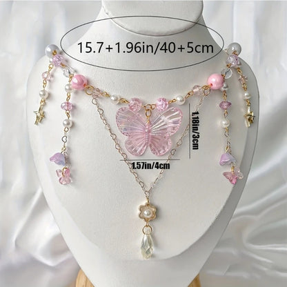 Soft pink crystal butterfly necklace bringing ethereal sparkle to romantic and kawaii outfits