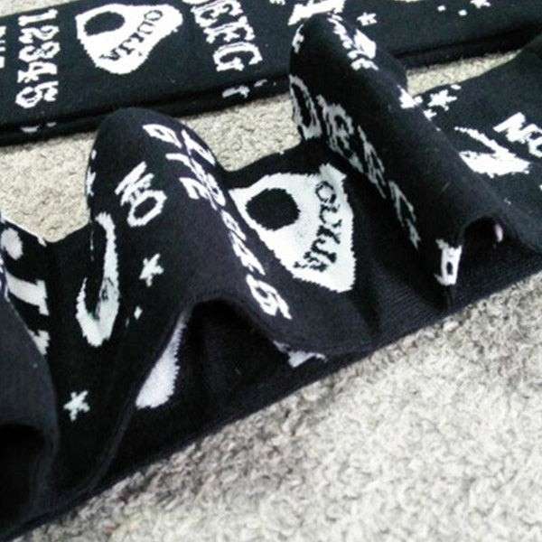 Softcore black and white dark magic stockings with occult symbols, perfect for kawaii gothic fashion