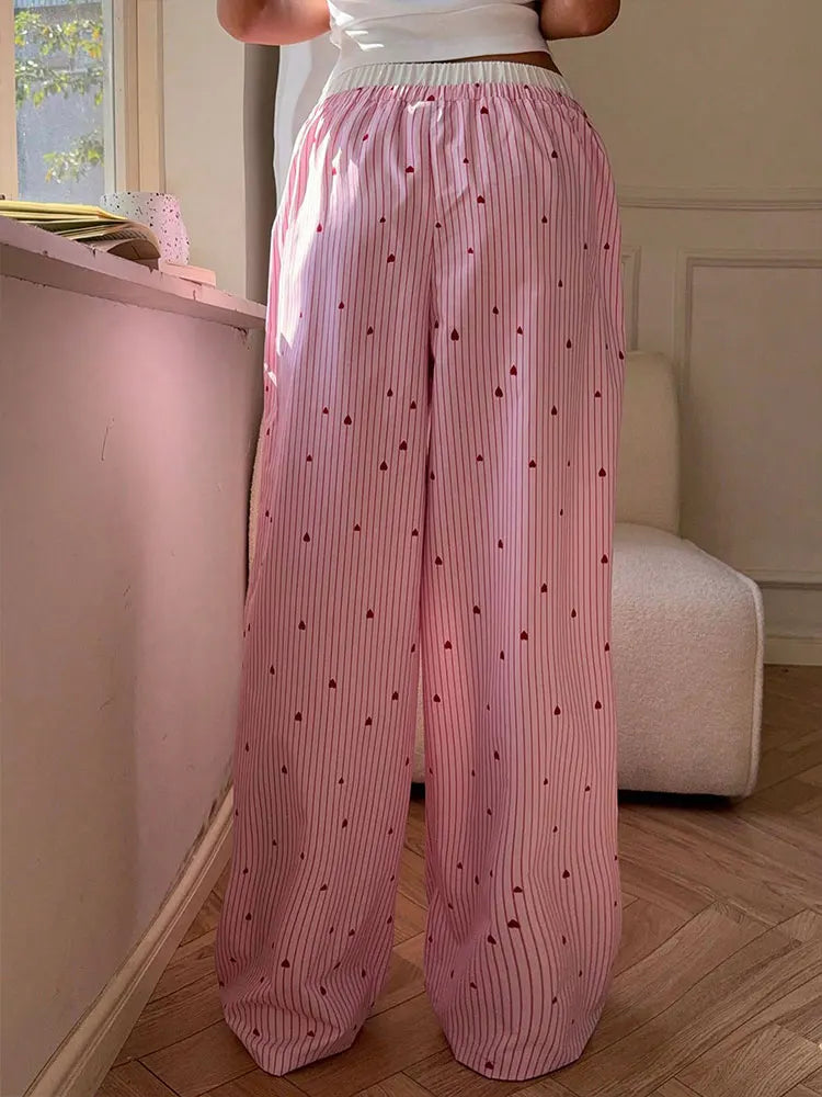 Softgirl style pink lace pants with heart-shaped lace-up sides, comfy and cute for ABDL and kawaii fans