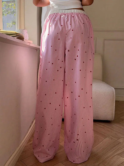 Softgirl style pink lace pants with heart-shaped lace-up sides, comfy and cute for ABDL and kawaii fans