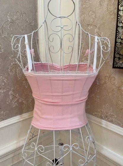 Back view of Spoiled Princess pink pearl detail tank top with delicate bows