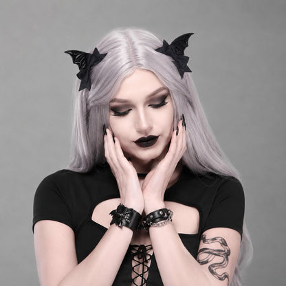 Flat lay of Spooky Lolita Bat Hair Clip showing full bat wing and red bow design for gothic kawaii Lolita cosplay and alt gifting