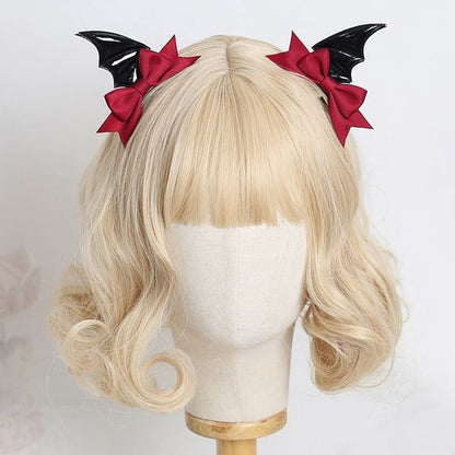 Spooky Lolita Bat Hair Clip with black bat wings and red satin bow for gothic kawaii Halloween Lolita and alt daily hair styling