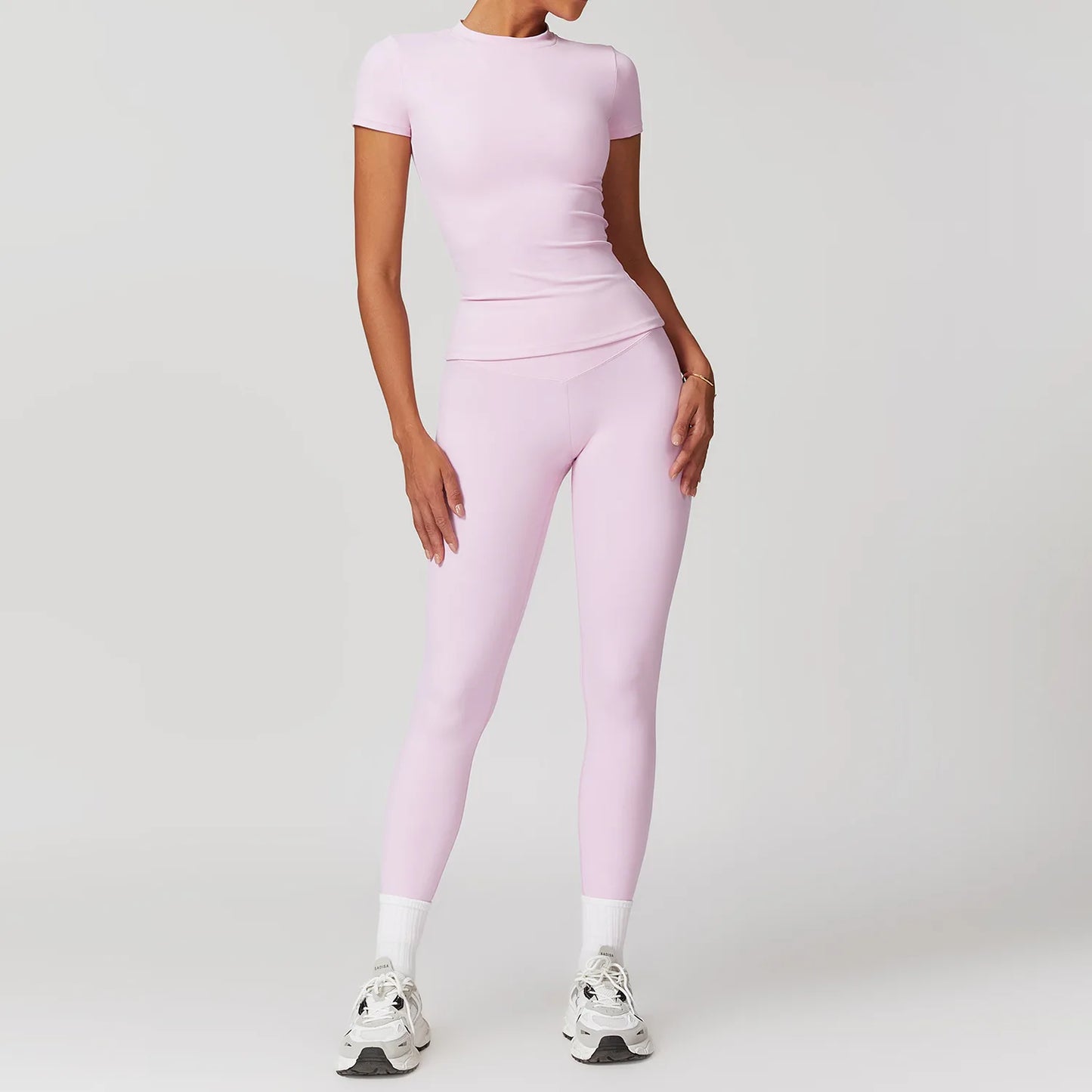 Sporty babygirl pink crop top and skirt set with breathable nylon spandex fabric for playful and comfy wear