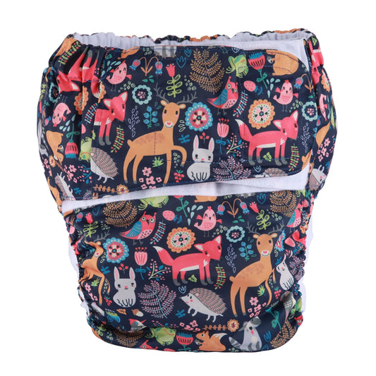 Starry forest animal ABDL diaper in navy blue with kawaii woodland critters and dreamy night sky for DDLG little space