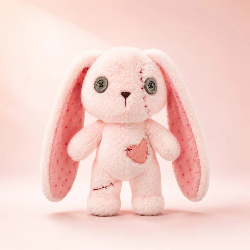 Pink stitched heart bunny doll plush with visible stitch details, creepy cute