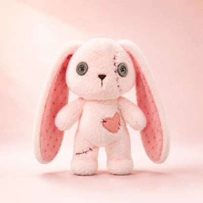 Pink stitched heart bunny doll plush with visible stitch details, creepy cute