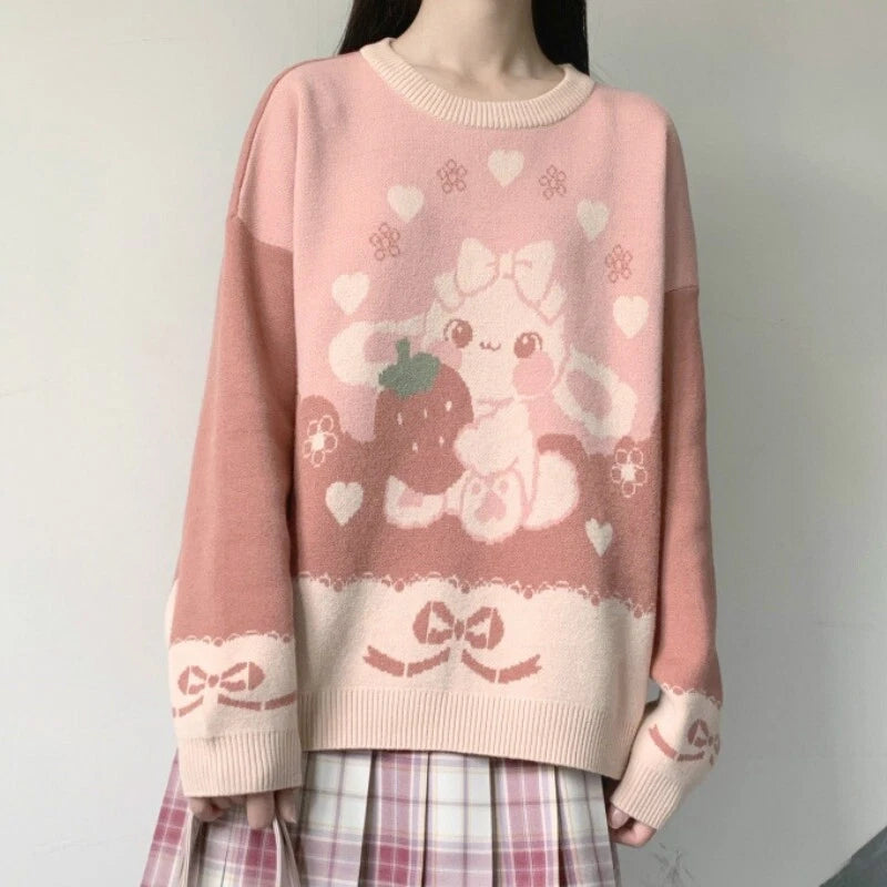 Storybook-inspired Strawberry Bunny Lolita sweater with pastel bunny artwork, ribbons, hearts, flowers, and kawaii knit style