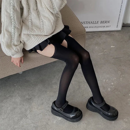 Black ruffle-trimmed thigh-high stockings with peekaboo cut-outs, a sexy and cutecore staple for littlespace.