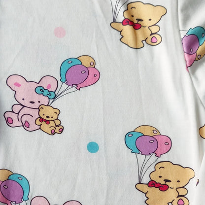 Flat lay of teddy balloon cuddle sleeper onesie with footed design