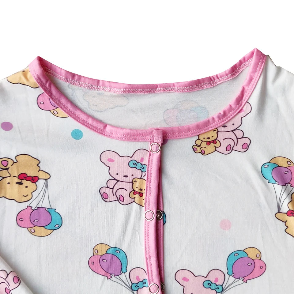 Full front metal snap closure detail on teddy balloon sleeper onesie