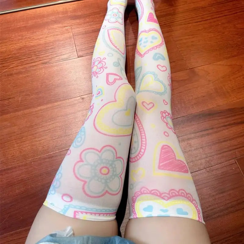 Tricolor pastel candy heart lace stockings with playful hearts and floral accents for kawaii fashion