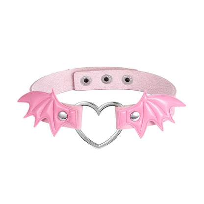 Pink bat heart choker with soft kawaii gothic aesthetic and buckle strap