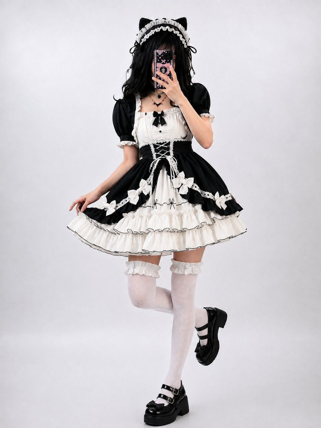 Model wearing black and white Victorian dream ruffle Lolita dress, DDLGirl style