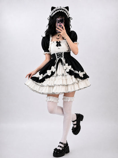 Model wearing black and white Victorian dream ruffle Lolita dress, DDLGirl style
