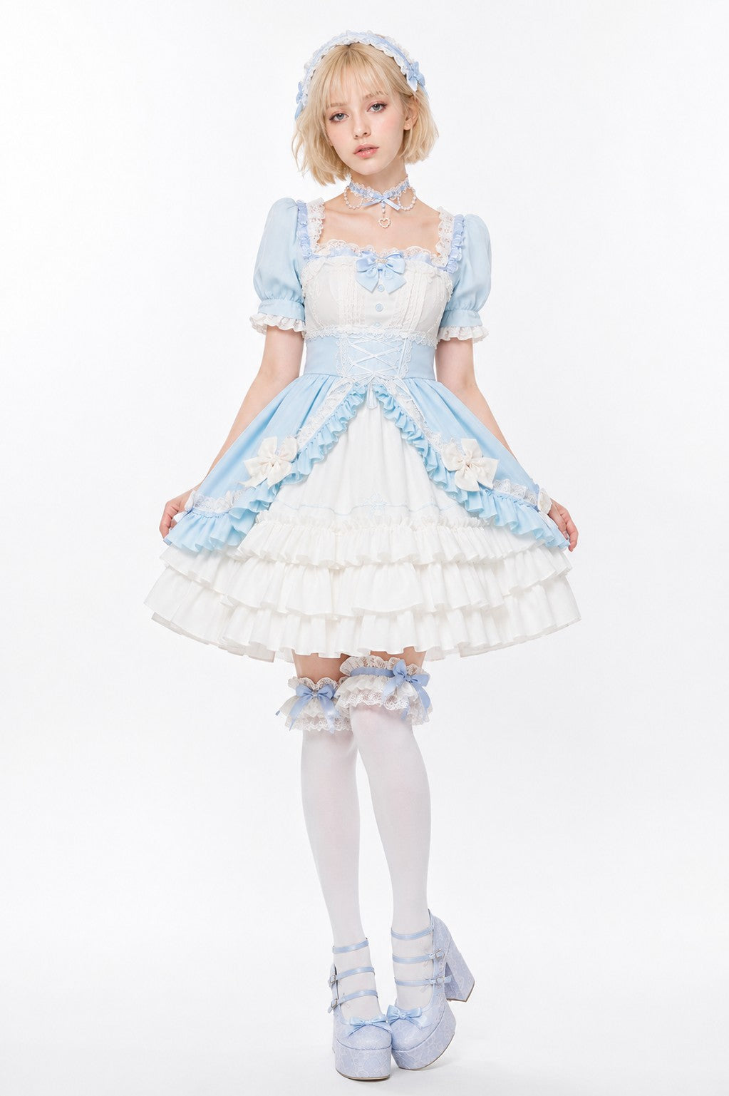 Model wearing pastel blue and white Victorian ruffle Lolita dress, dollcore fairytale style