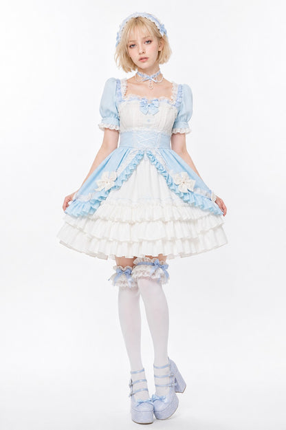 Model wearing pastel blue and white Victorian ruffle Lolita dress, dollcore fairytale style
