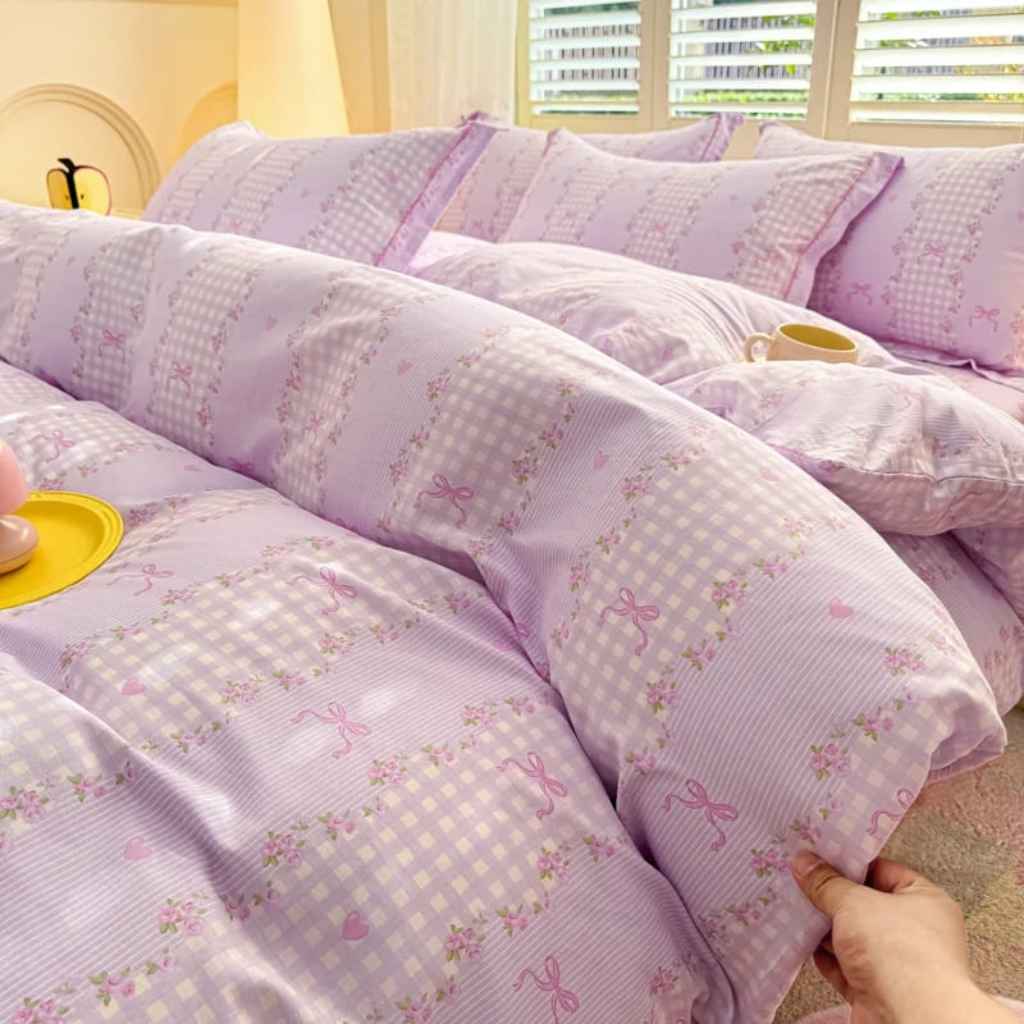 Victorian-inspired purple plaid bedding with purple stripes and bow details, ideal for dreamy vintage and kawaii bedrooms