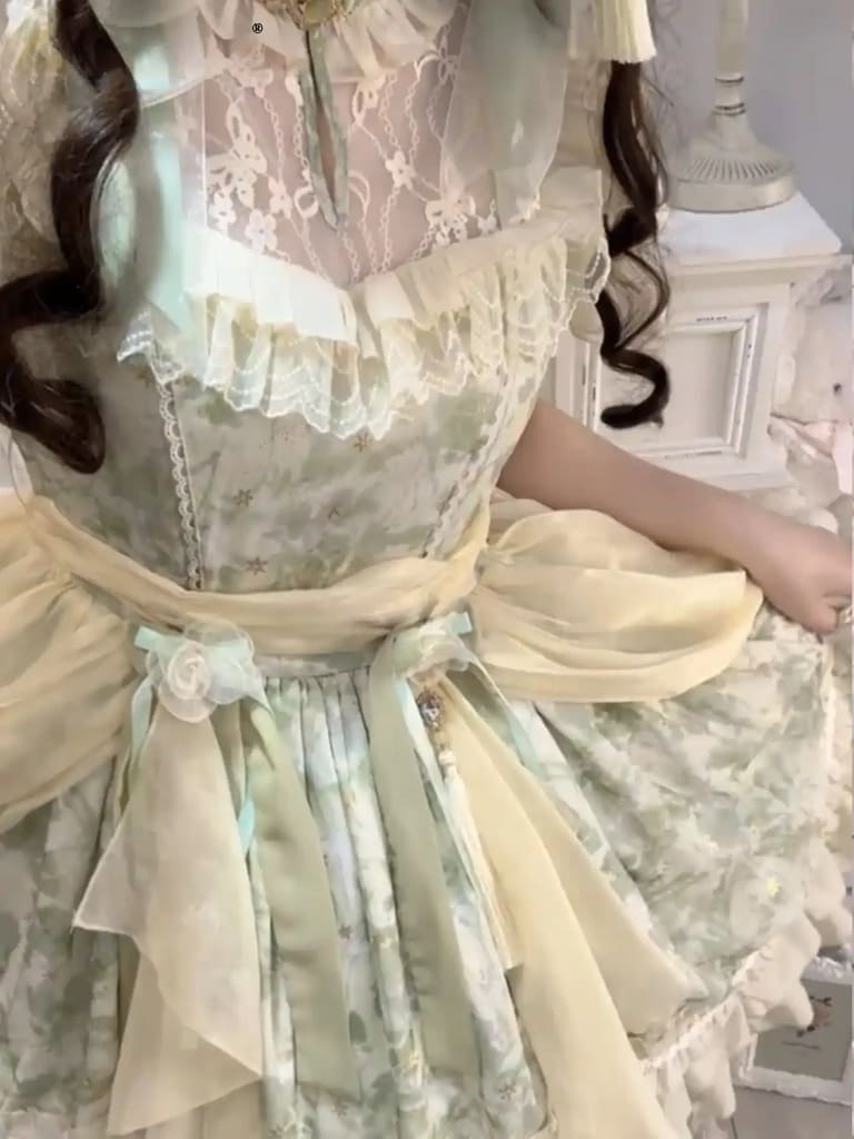 Vintage Victorian-inspired Lolita dress in soft pastel tones with classic cottagecore details
