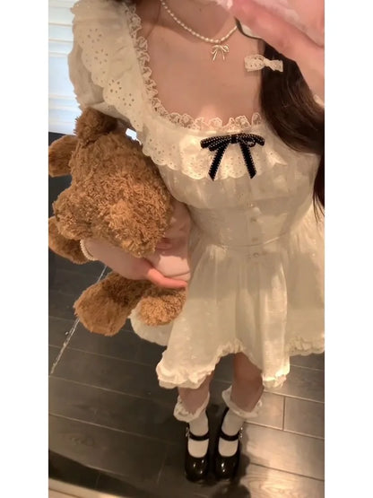White kawaii mini dress with frilly details and black ribbon, perfect for DDLG, ABDL, cutecore outfits