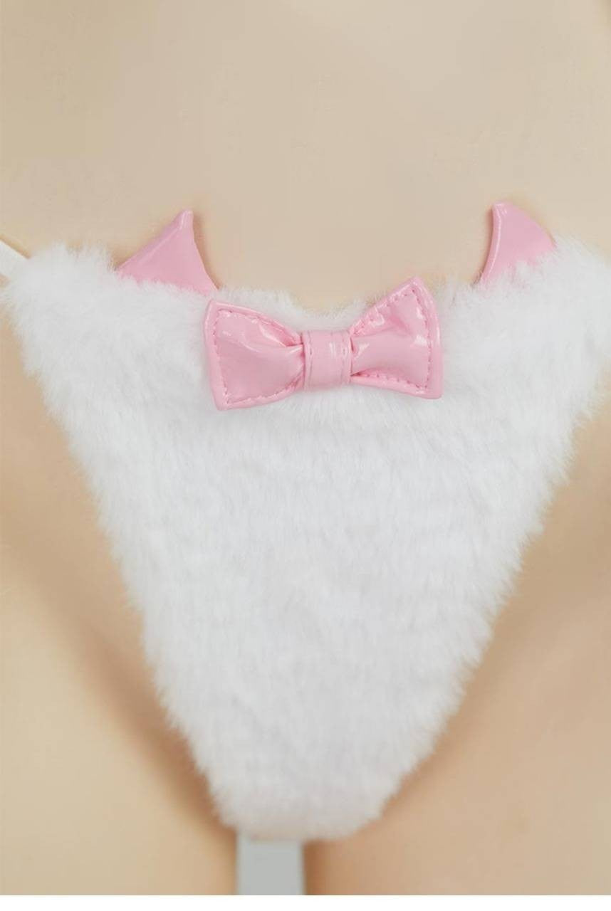 Close-up detail of white kitty cosplay thong with 3D cat ears, ribbon bow and tail attachment from kawaii kitty plush corset cosplay set