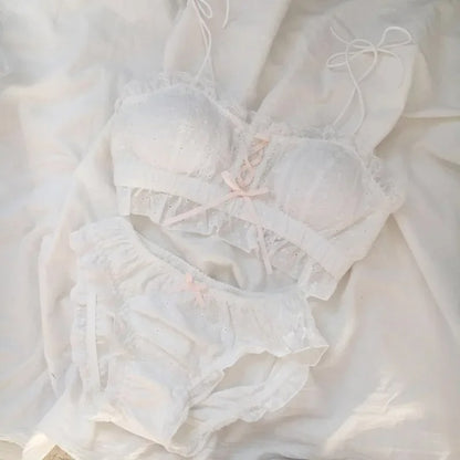 White pastel lace bra and panty lingerie set with soft dollcore aesthetic and feminine ruffle details