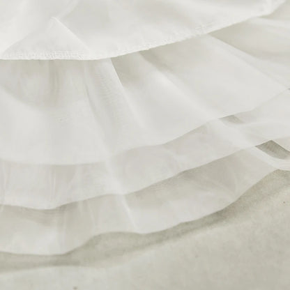 Close-up of white petticoat fabric showing soft breathable material texture