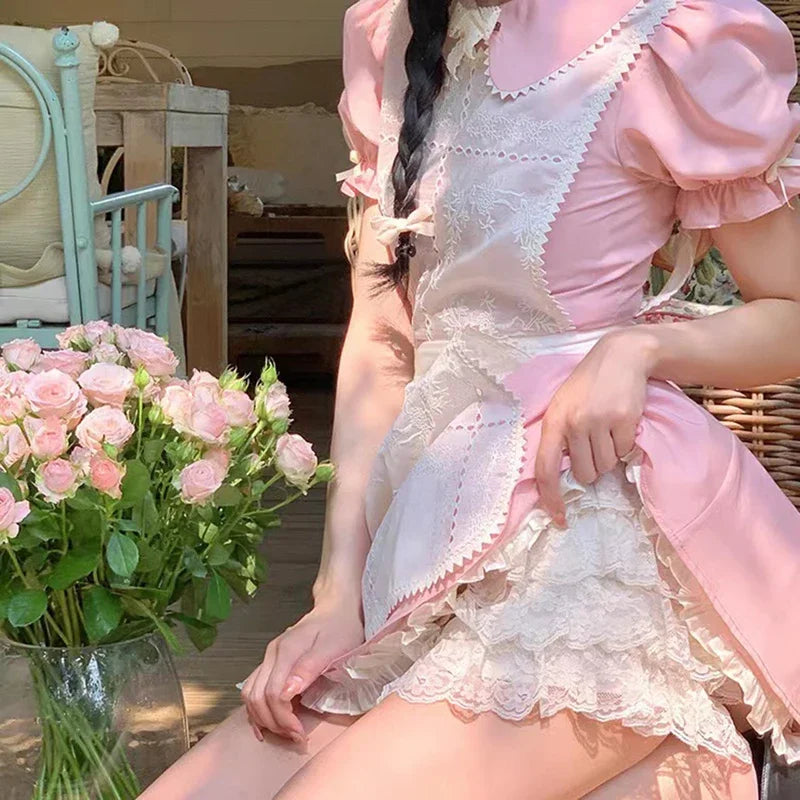 White Lacy Dream Ruffle Shorts styled under a pastel pink dress for a cute layered look