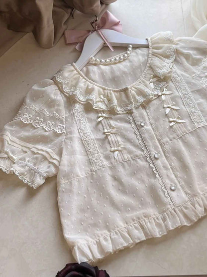 White ruffle lolita blouse in fairycore kawaii style with lightweight fabric and puff sleeves