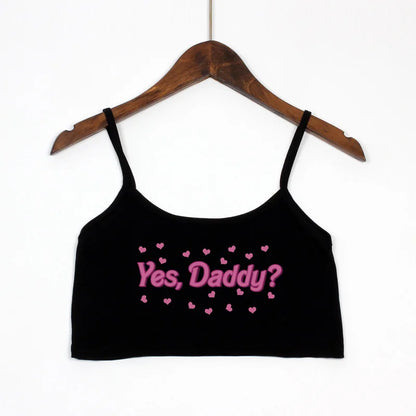 Black Yes Daddy cami crop top front view, soft and comfy fabric with cropped fit, ideal for pairing with high-waisted bottoms